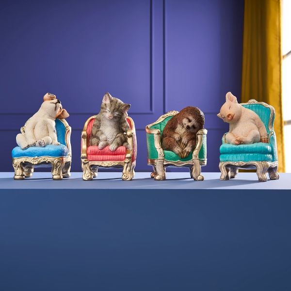 Hovedbilde Gris som tar en lur i en lenestol